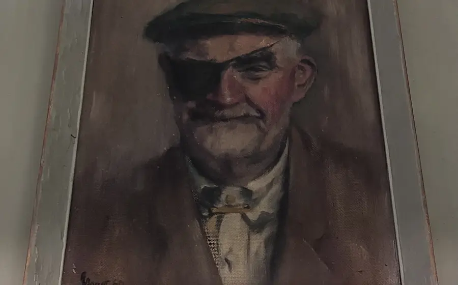 a painting of ted banks by George Barrett and with his eye patch on