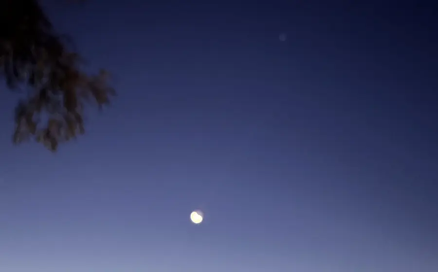 a moon in the sky late at night