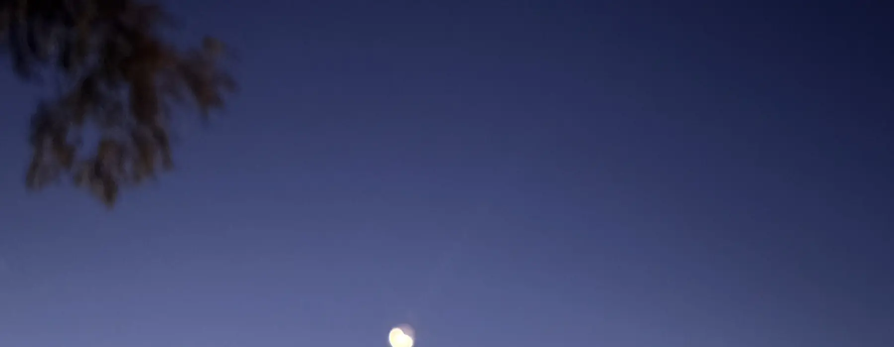 a moon in the sky late at night