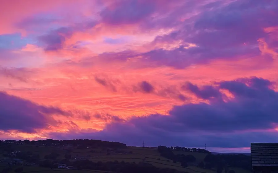 The sun setting on Saturday night in purple across the sky