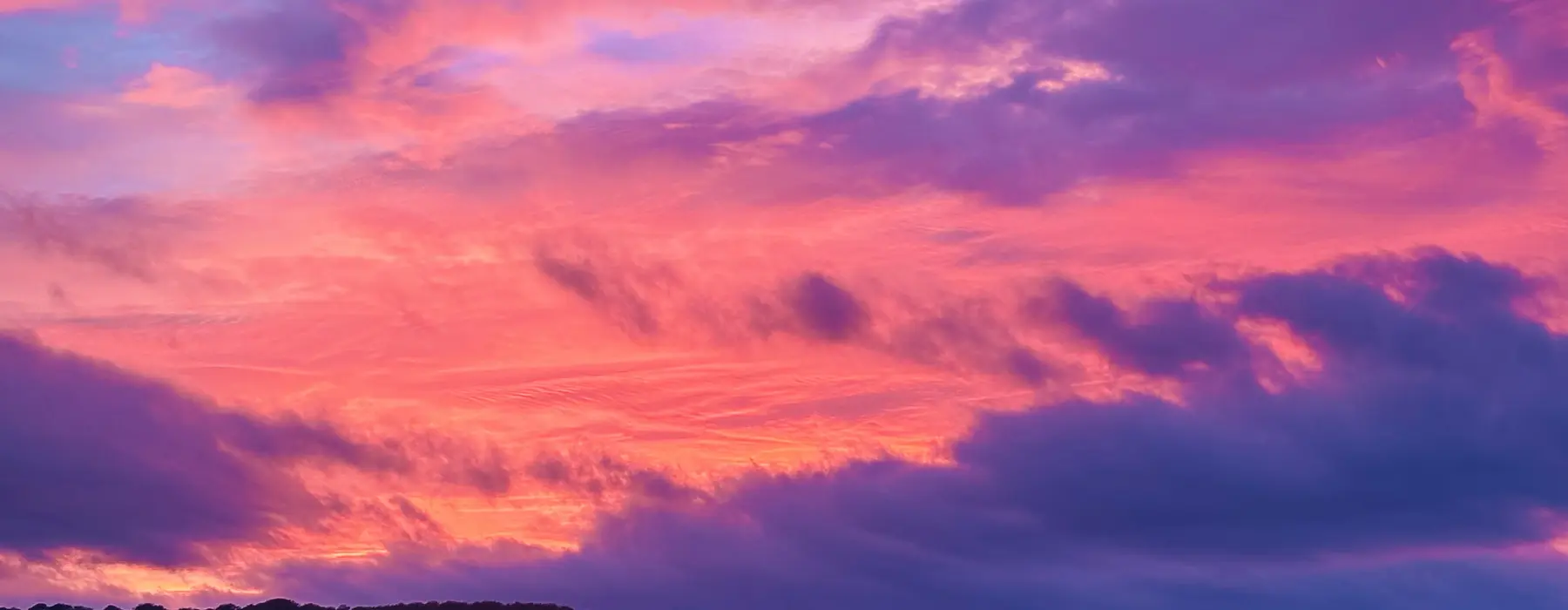 The sun setting on Saturday night in purple across the sky